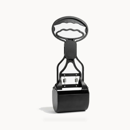 Black long-handle pet waste scooper on a clean white background